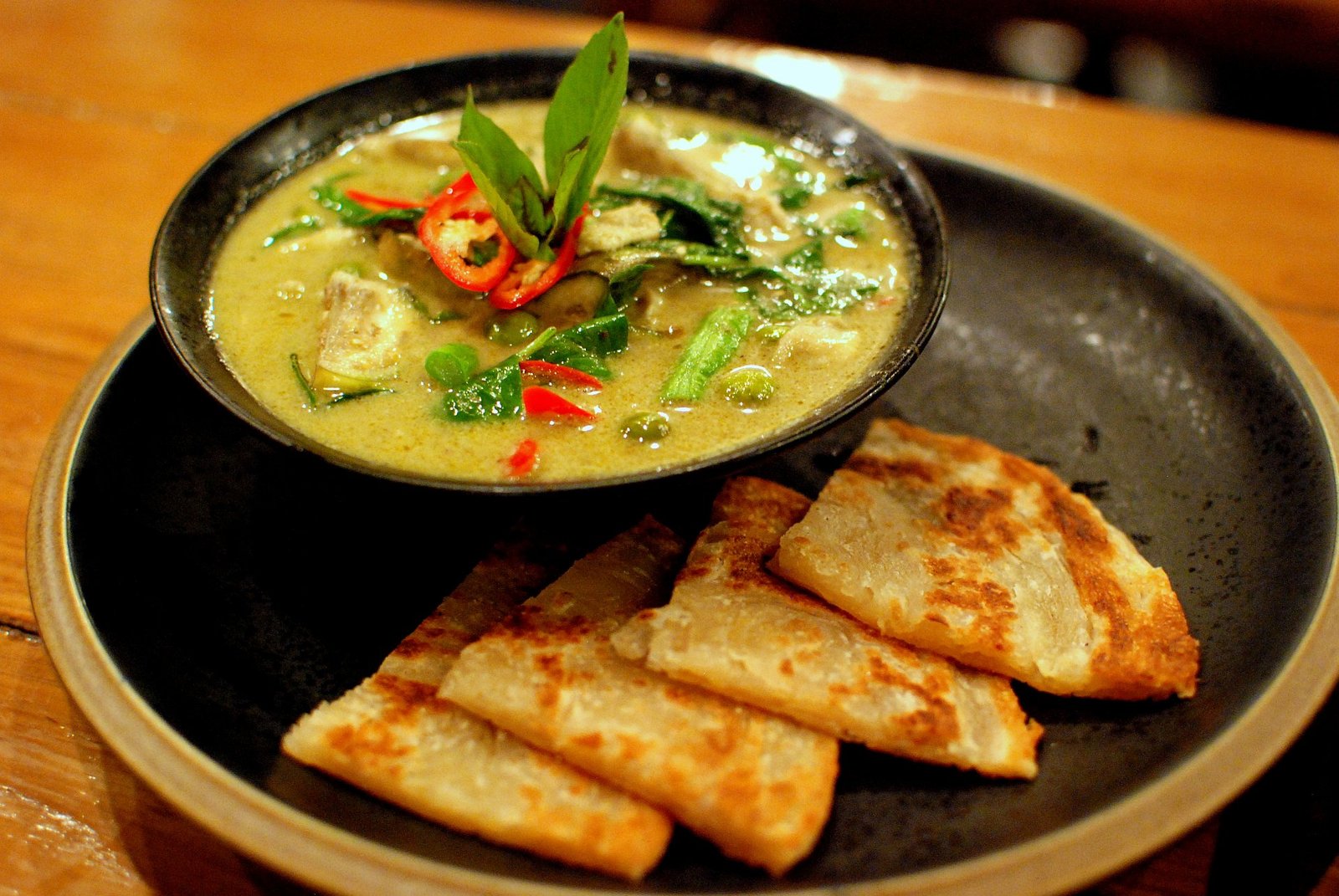Thai green chicken curry served with roti