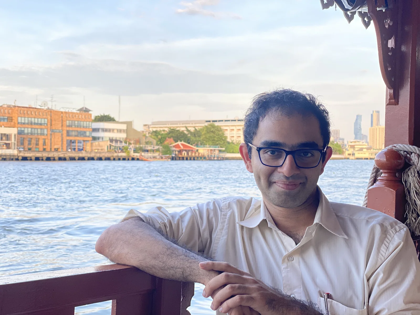 A boat crossing the Chao Phraya, the river transport that defines arrival at the resort