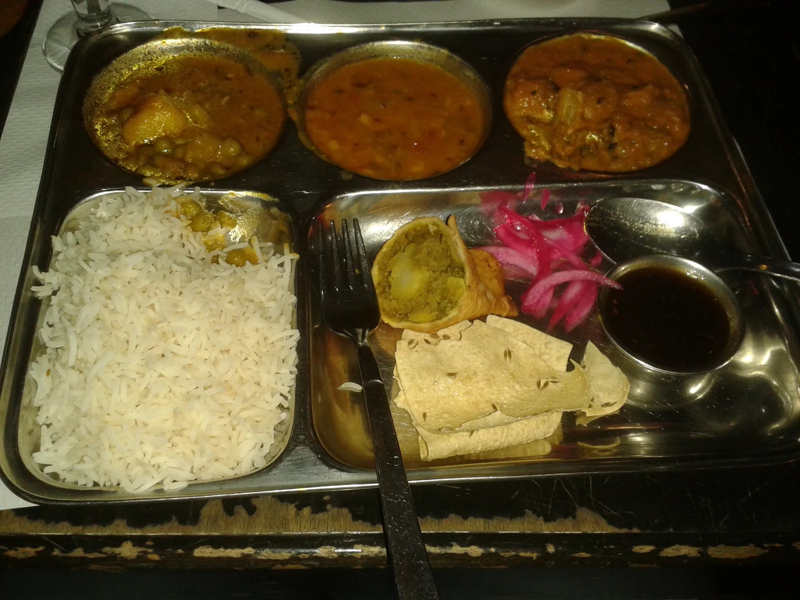 An Indian mixed thali with multiple small dishes