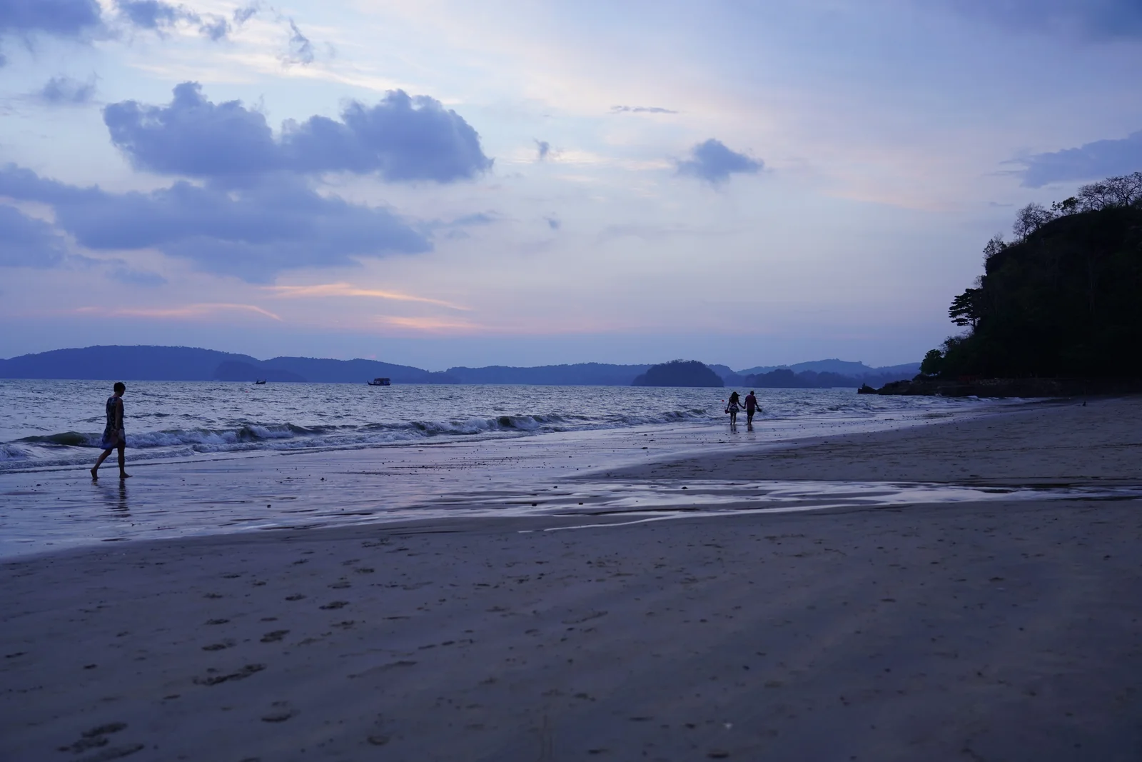 Ao Nang beach in Krabi with longtail boats and karst headlands