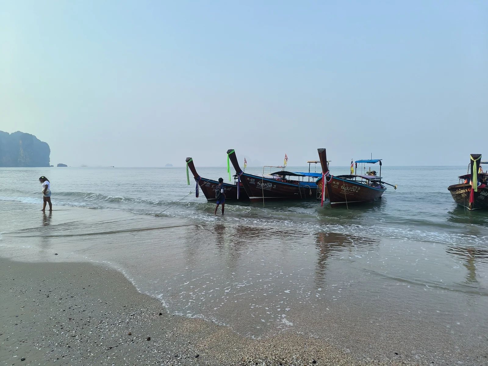 Ao Nang Beach Krabi Thailand longtail boats and limestone karst