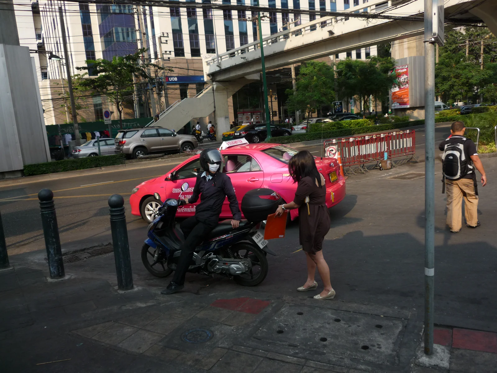 Bangkok pink and green taxis on a Sukhumvit road during day