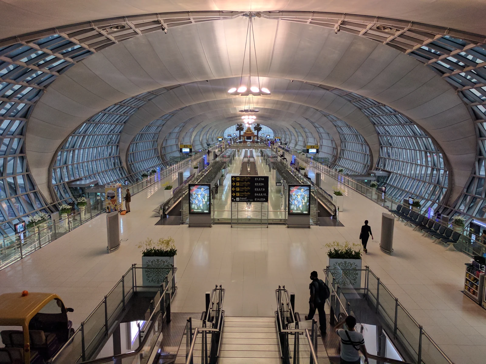Suvarnabhumi Airport terminal interior at dusk before passport control