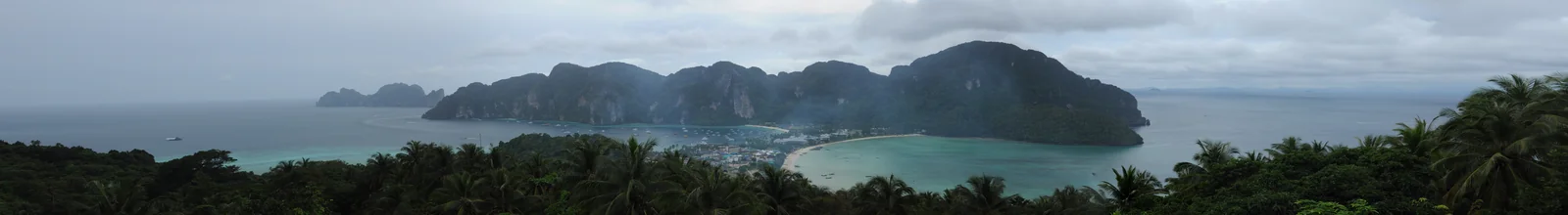 Phi Phi Don viewpoint panoramic showing the twin bays Tonsai and Loh Dalum that travelers reach via Phuket or Krabi from Bangkok