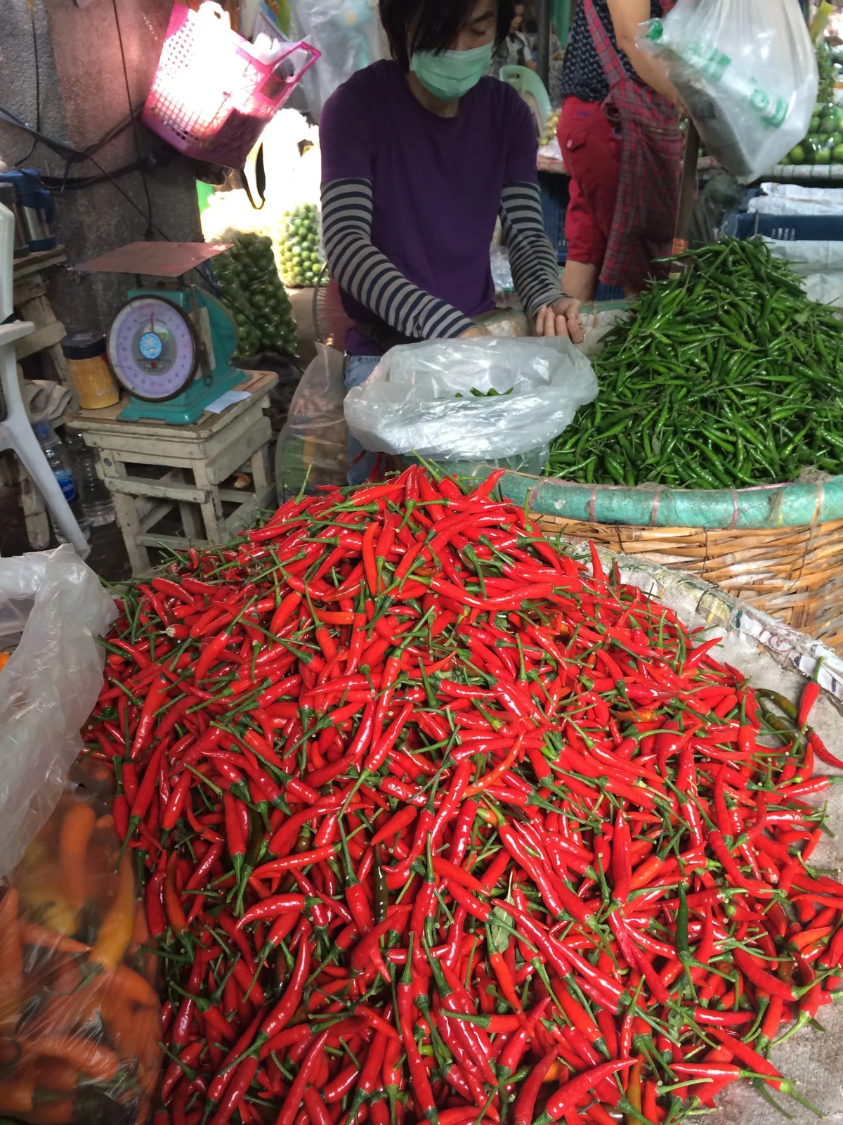 Red and green chilies for sale at a fresh produce market in Bangkok