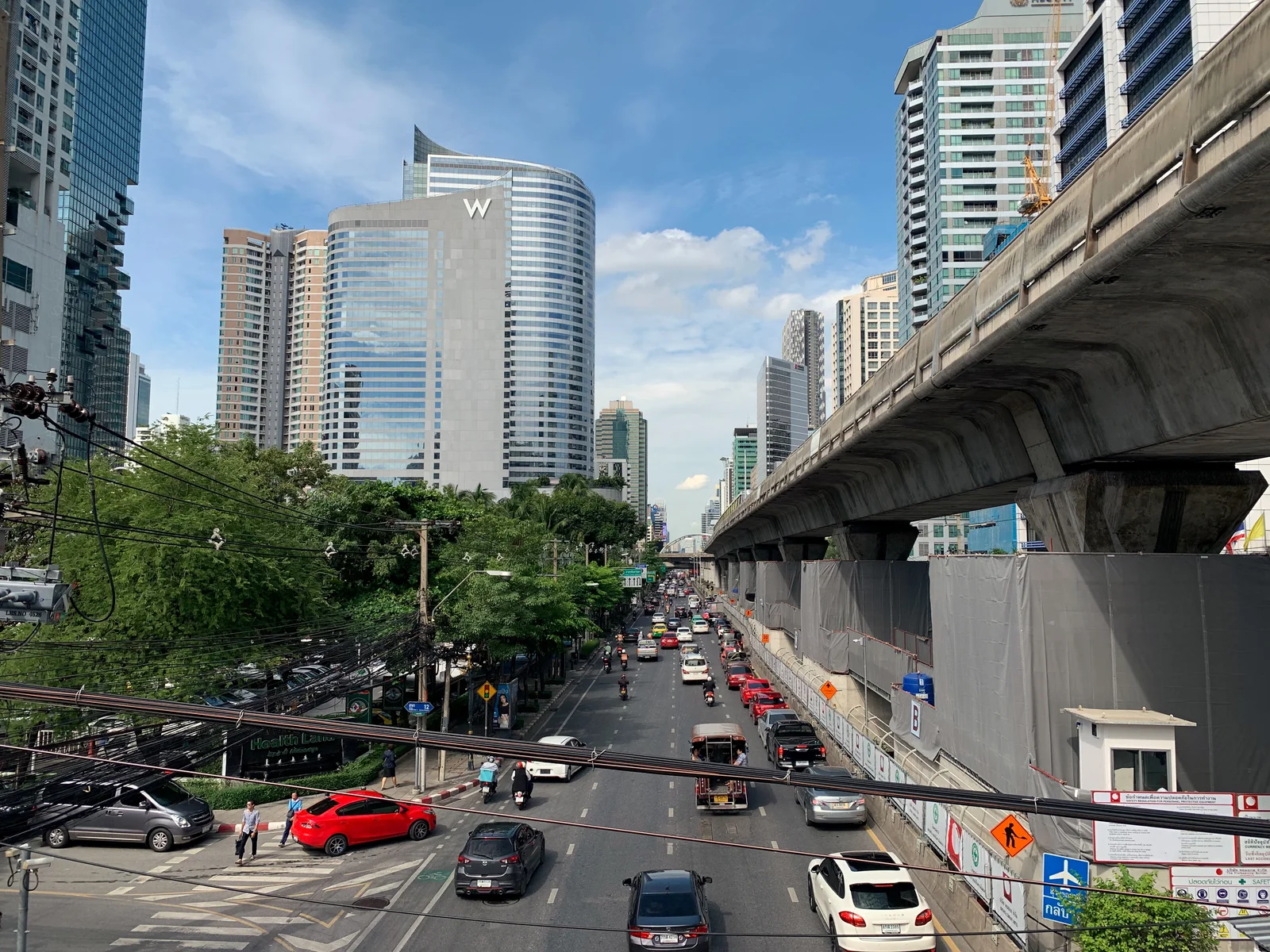 North Sathorn Road in the Bangrak business district where SO Bangkok sits, with high-rise towers and traffic at street level