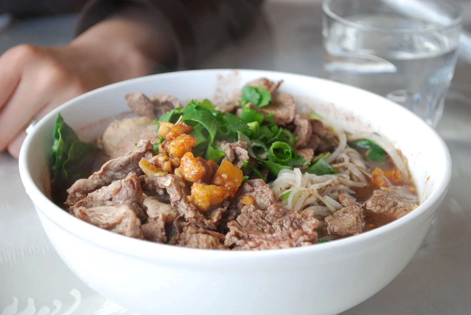 Small bowls of Thai boat noodles, guay teow reua, served at a Bangkok noodle stall