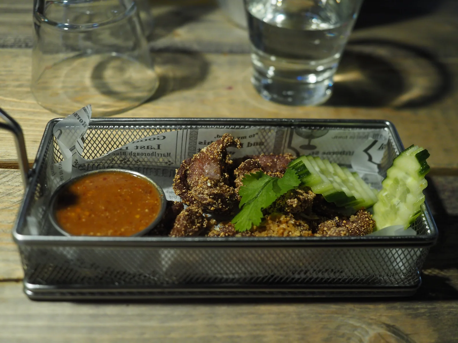 Thai barbecue pork neck with traditional nam jim jaew sauce, the Thai culinary tradition that Côte by Mauro Colagreco draws contrast against