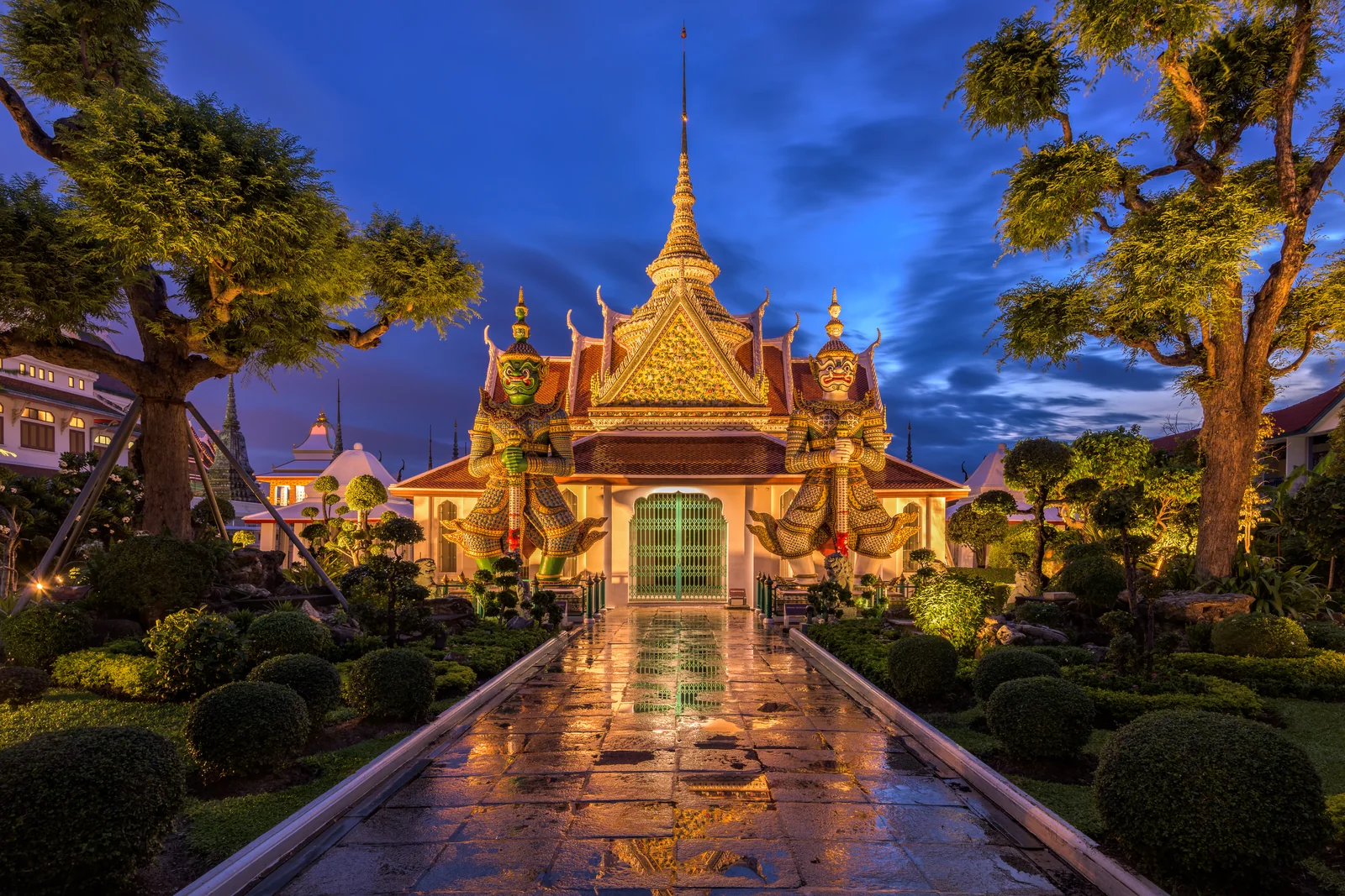 Wat Arun temple at sunset on the Chao Phraya river in Bangkok