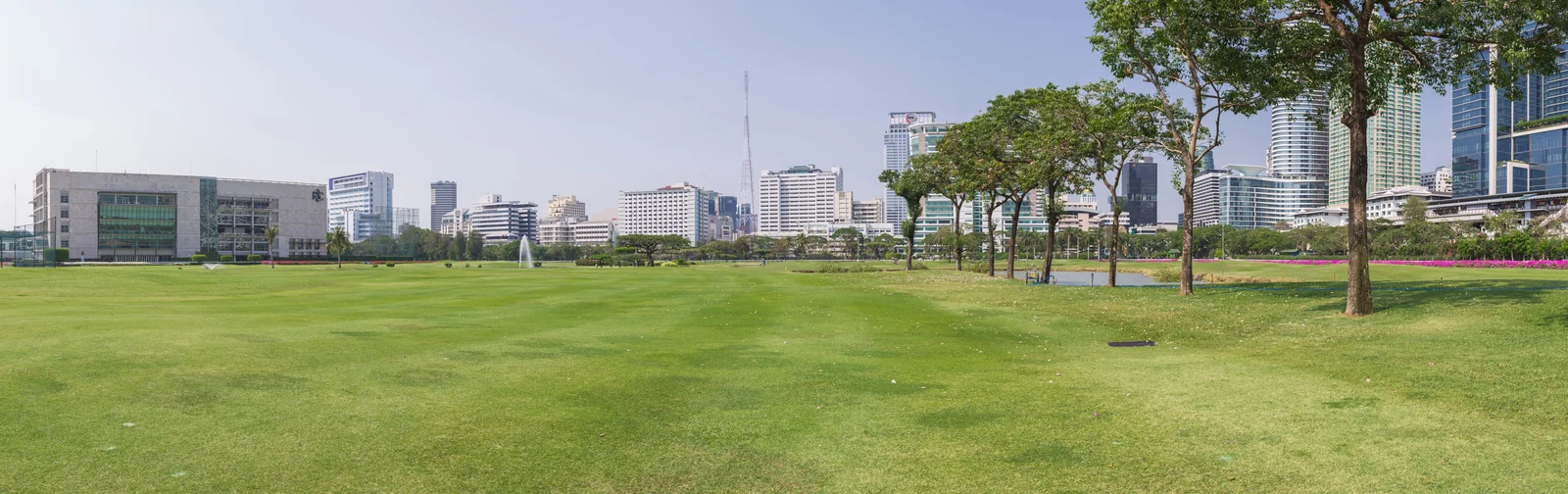 The green expanse of the Royal Bangkok Sports Club that the Waldorf park-view rooms and pool overlook