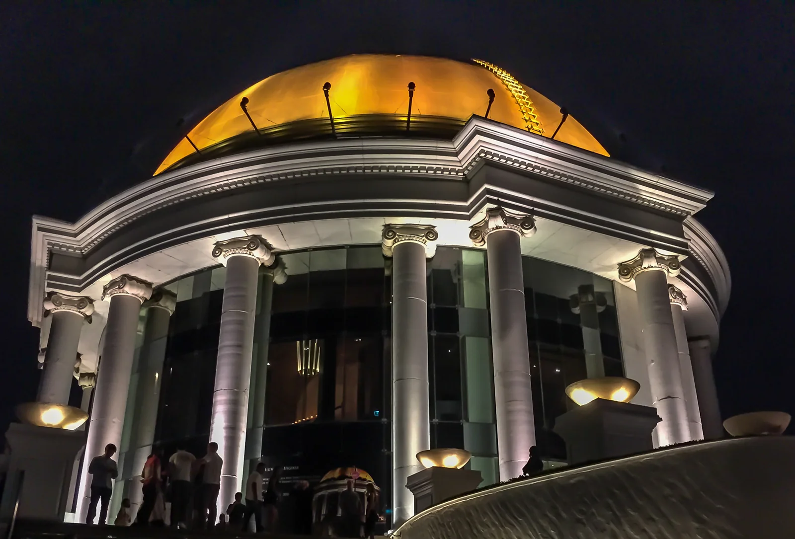 The illuminated golden dome of The Dome at lebua at State Tower, home to the Sirocco rooftop and Sky Bar