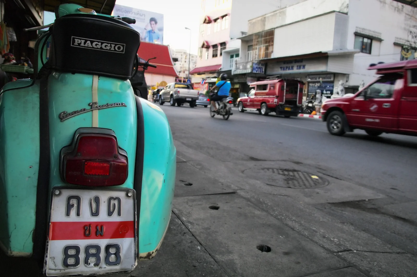 Honda automatic scooter parked on a Thai street, the standard rental machine on Koh Samui